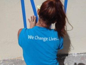 Gersh Academy Staff Member Posing in Her "We Change Lives" Shirt