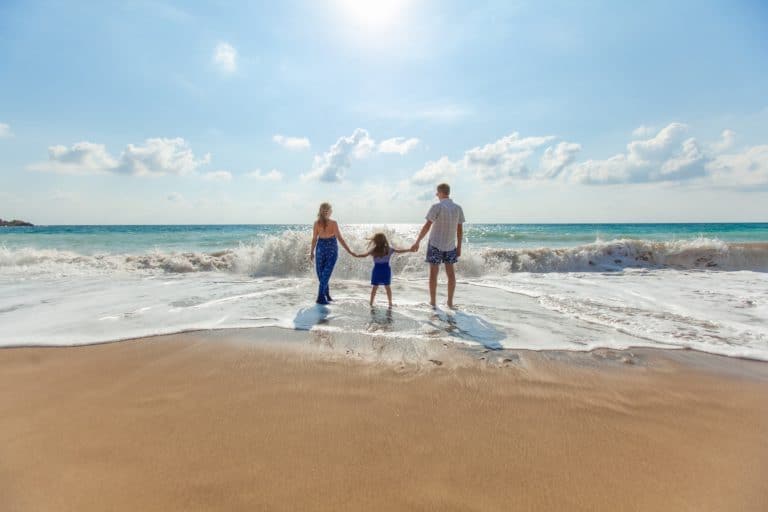 Family together at the beach