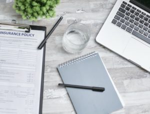 laptop computer, notebook, form and pens